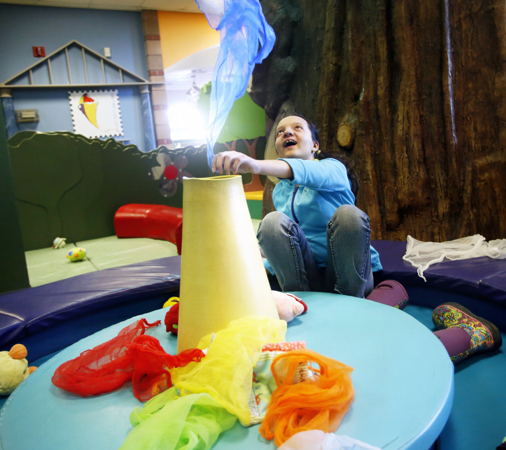 Eleven-year-old Hannah Taylor of Westbrook, who is autistic, plays in an exhibit at Portland Children's Museum on Saturday. Derek Davis/Staff Photographer