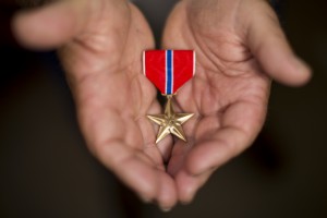Dennis Andrews displays his Bronze Star after receiving it at a ceremony attended by hundreds Saturday.