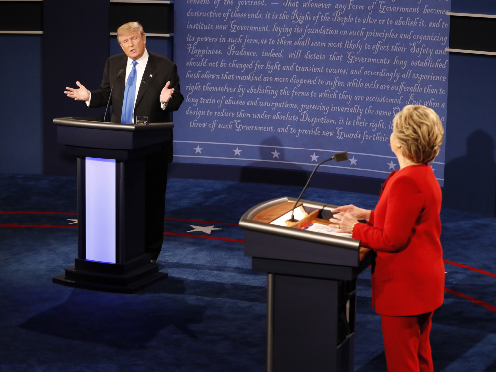 Donald Trump gestures toward Hillary Clinton during the presidential debate Monday night at Hofstra University.
