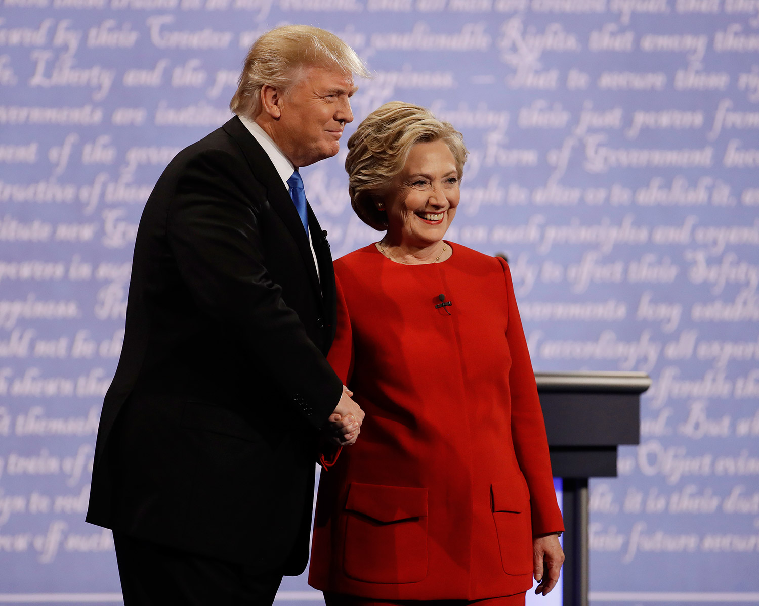 Hillary Clinton and Donald Trump shake hands before Monday night's presidential debate at Hofstra University in Hempstead, N.Y.