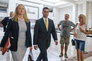 Bryan Pagliano, center, a former State Department employee who helped set up and maintain a private email server used by Hillary Rodham Clinton, departs Capitol Hill on Sept. 10, 2015. He refused to appear Tuesday before the Oversight and Government Reform Committee. Cliff Owen Lee/Associated Press
