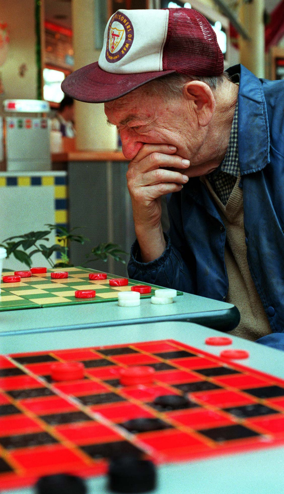 Saturday, November 23, 1996 -- Nate Cohen ponders his next move as he competes with Rodney Scoville at the Maine Mall.