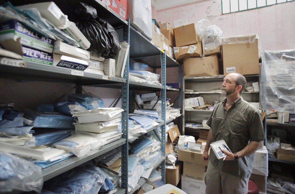 Nate Nickerson, executive director of Konbit Sante, looks over medical supplies in a store room at the Justinian Hospital on Tuesday, January 19, 2010. The store room for the supplies and staff to inventory the supplies that are donated is one way Konbit Sante provides ongoing support to the Justinian Hospital.