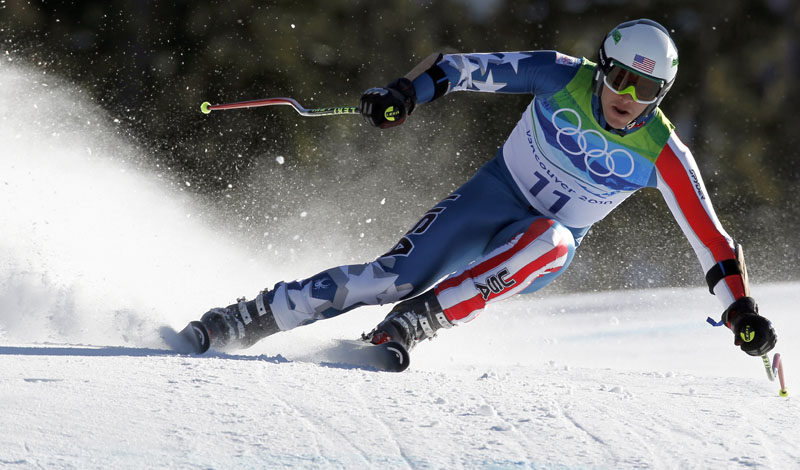 Bode Miller of the United States speeds down the course during the Men's super-G. Miller took the silver medal, trailing by 0.28 seconds, making him the most decorated American Alpine skier in history.