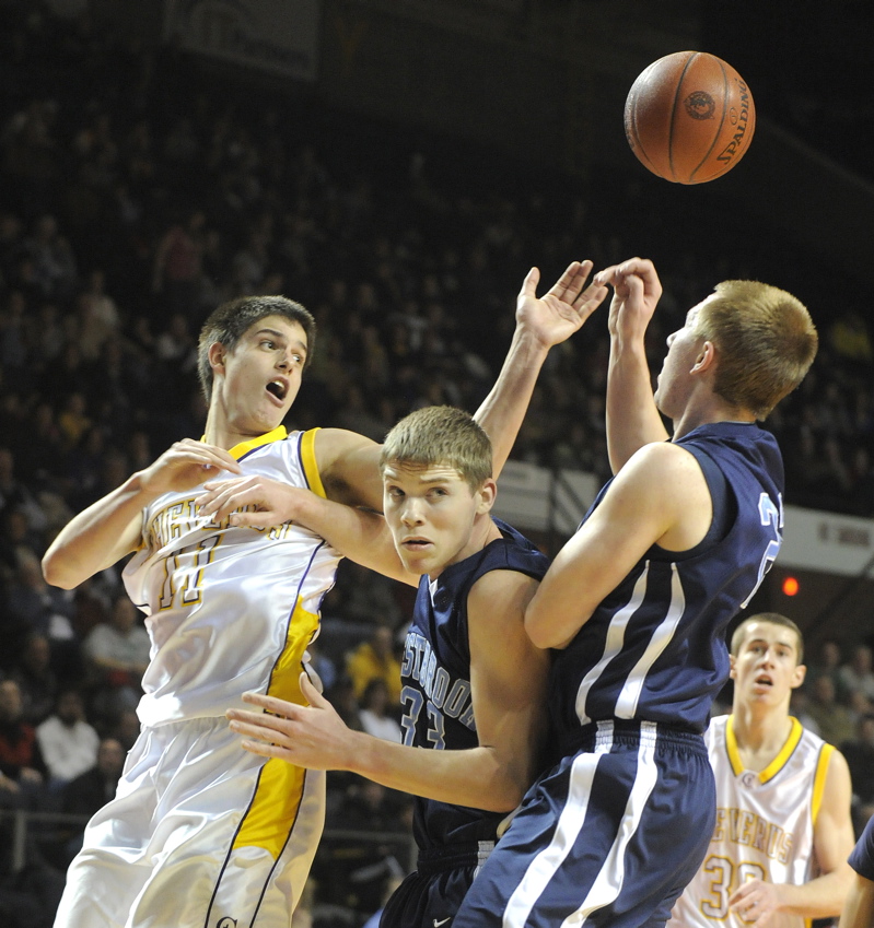 Indiana Faithfull, left, of Cheverus and Andrew Beckwith, right, of Westbrook have their eyes on a loose ball.