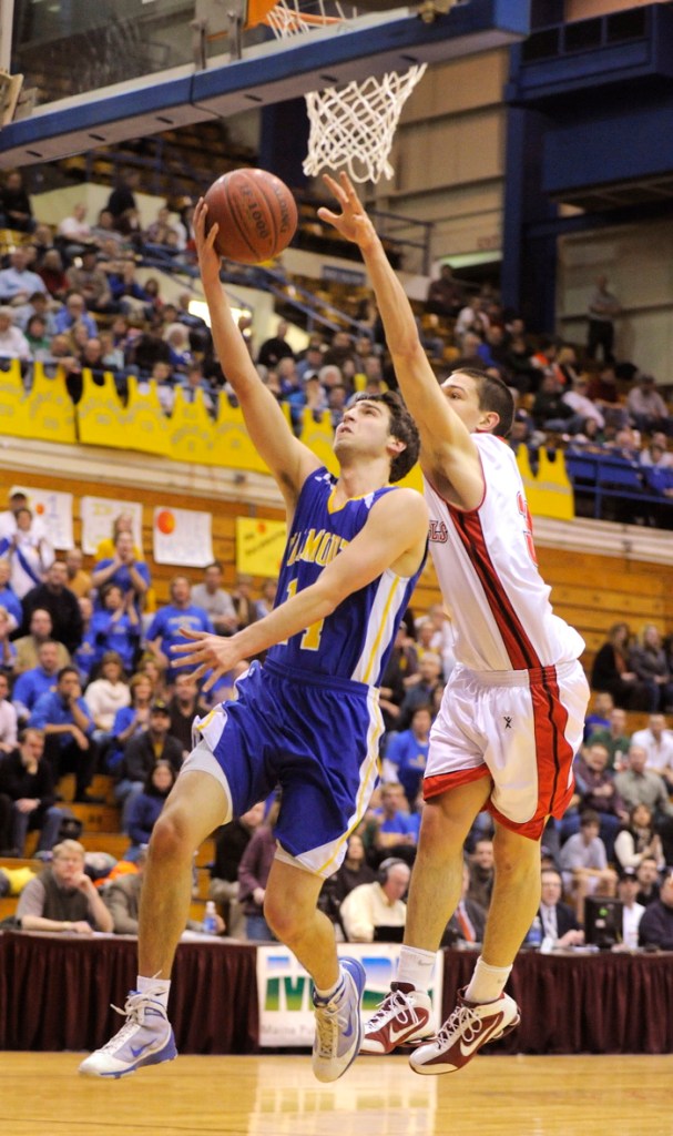 Sam Horning of Falmouth puts up a shot against Tyler McFarland.