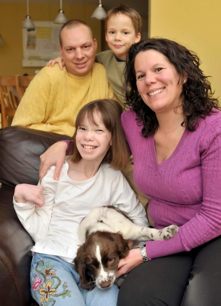 Emily Martin, 12, with her mother, Kirsten, father, Jeff, brother, Jack, 7, and puppy Reagan. Emily’s special ed teacher saw her potential and shifted the focus onto her abilities.
