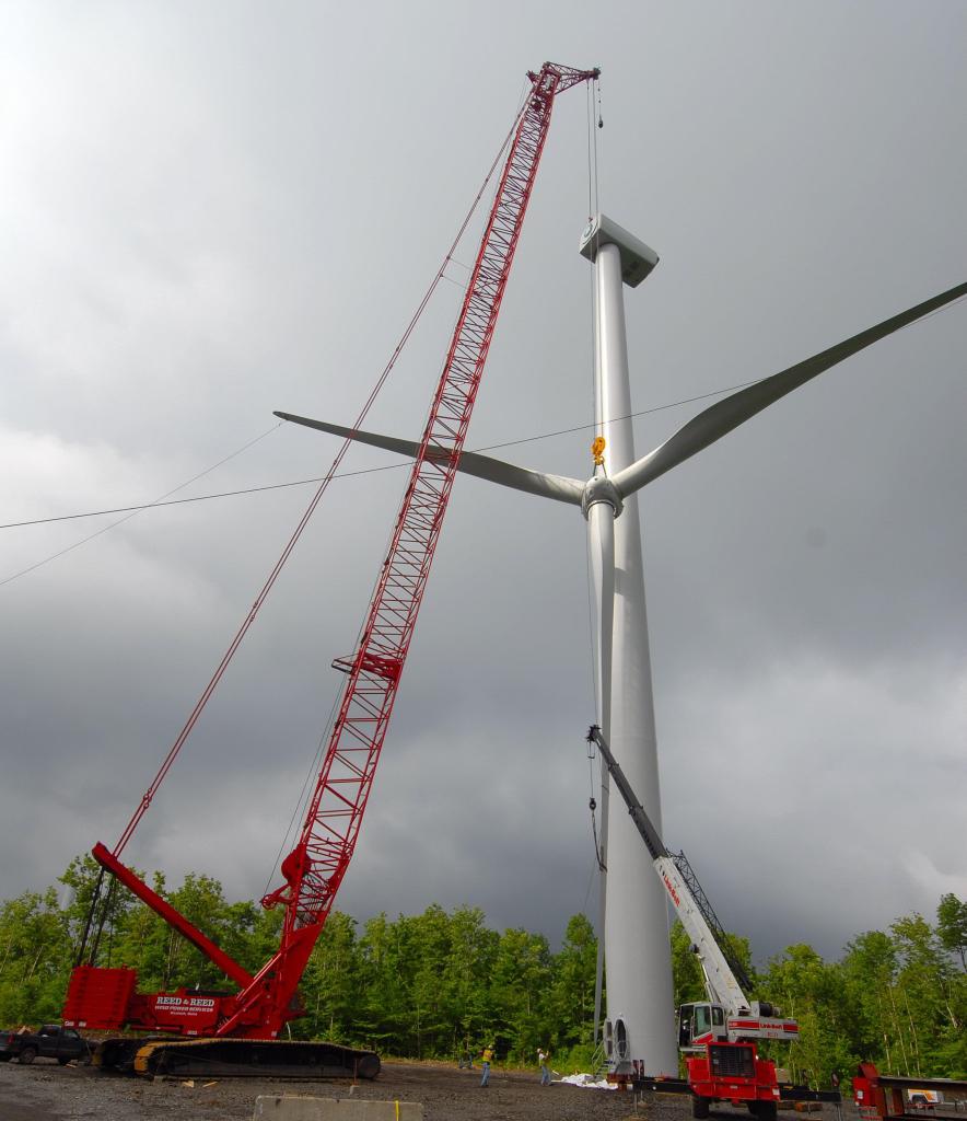 A crew from Reed & Reed Inc. of Woolwich lifts a rotor for a 263-foot wind turbine on Stetson Mountain in Washington County recently. The Stetson wind farm is expected to be operating by late this year.