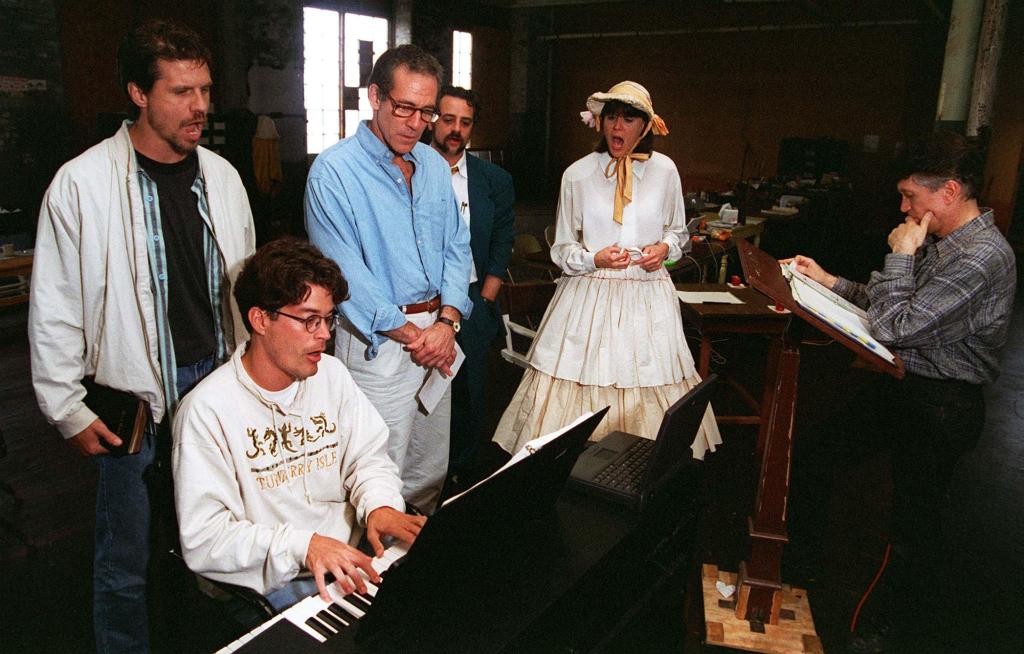 Charles Abbott rehearses with cast members of “Chamberlain” (1996).