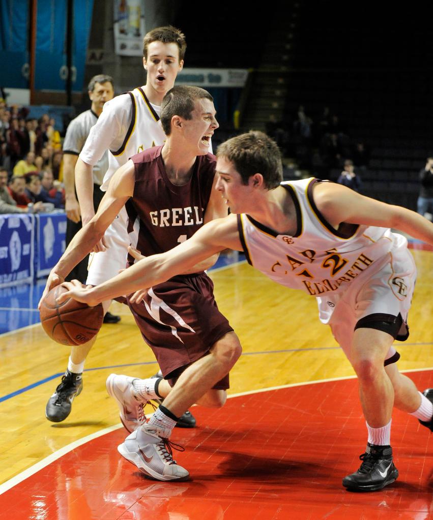 John Ewing/Staff Photographer Ben Brewster of Cape Elizabeth knocks the ball from Sam Johnston of Greely during the closing seconds of the Capers' 51-43 victory Thursday night at the Civic Center.