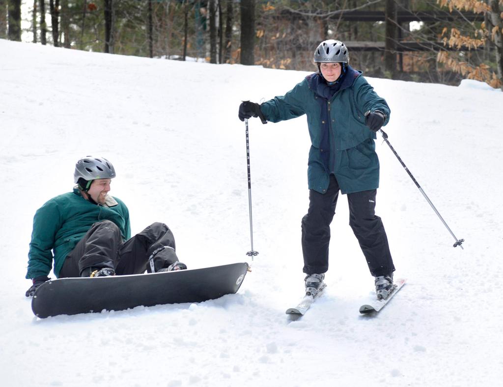 Drew Sachs and wife Melanie, children Deidre, 11, and Peter, 9, learn to ski and snowboard at Lost Valley in Auburn on Feb. 19. Melanie Sachs, above, skis past Drew.