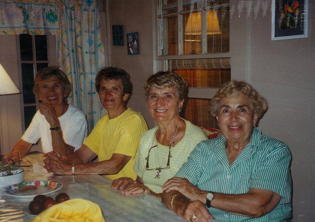 Mildred Doukas, second from left, is shown at the table at the Higgins Beach family cottage in Scarborough. Others from left are her sisters Virginia Doukas, Despina Athans and Stella Doukas.