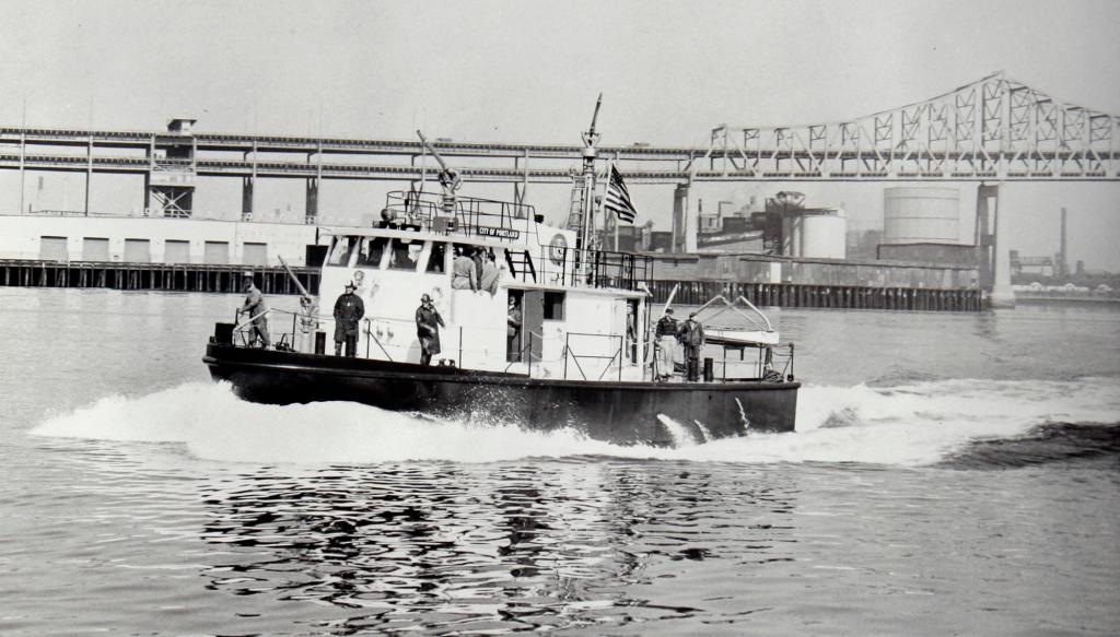 The City of Portland fireboat, now known as the City of Portland III, and soon to be retired, leaves Boston Harbor where it was built and christened in 1959.
