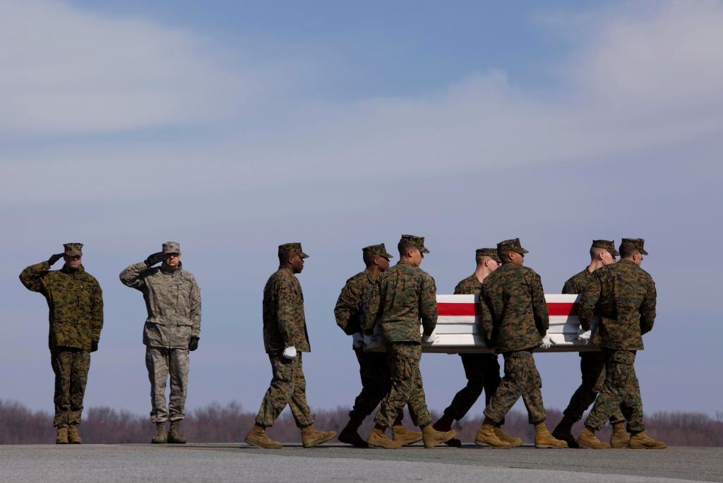 U.S. Marines carry the remains of Lance Cpl. Kielin T. Dunn on Saturday at Dover Air Force Base in Delaware. Dunn, of Chesapeake, Va., was killed in Afghanistan. NATO said one service member died in a roadside bombing Sunday.