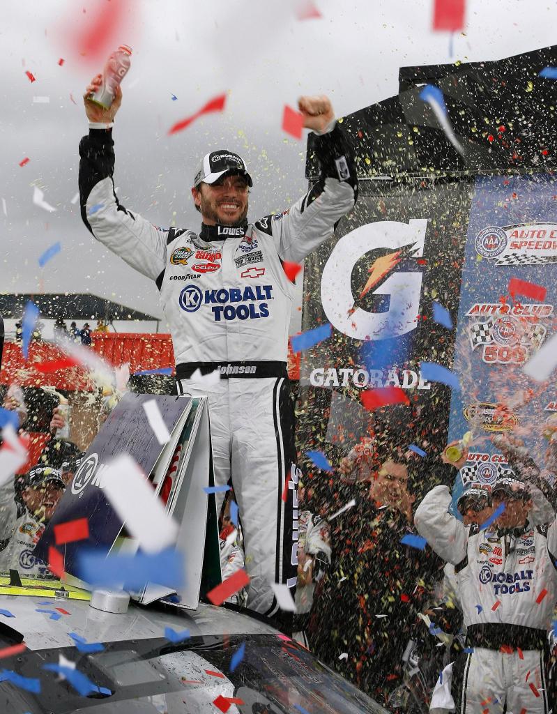 Jimmie Johnson strikes a familiar pose Sunday after winning the Auto Club 500, the 48th career victory for the four-time defending Sprnt Cup champion.