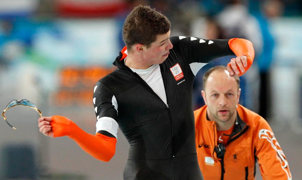Sven Kramer of the Netherlands tosses his glasses away Tuesday after being disqualified for forgetting to switch a lane.