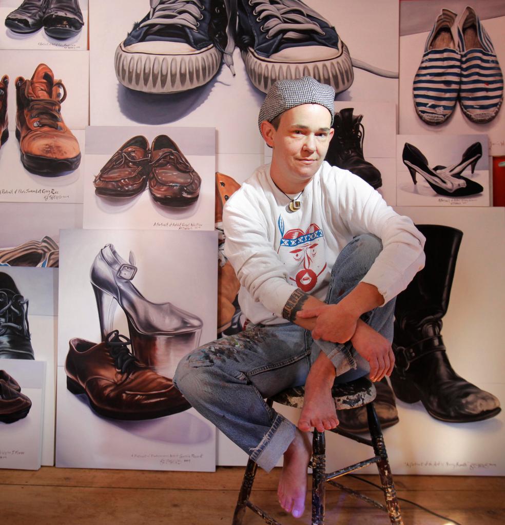 Kelly Jo Shows at home in Kennebunk with some of her shoe portraits.