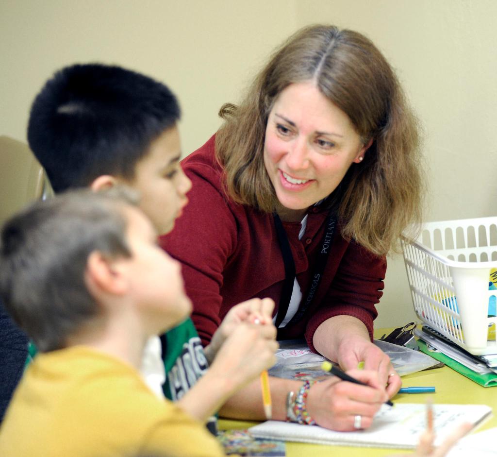 Teacher Lara Pratt works with second-graders Alex Sim and Zack LaCour at Longfellow Elementary School in Portland.