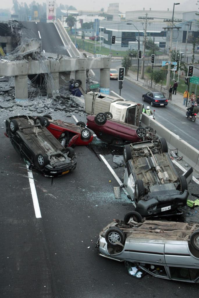 Vehicles litter a collapsed highway near Santiago after a powerful quake struck central Chile early Saturday.