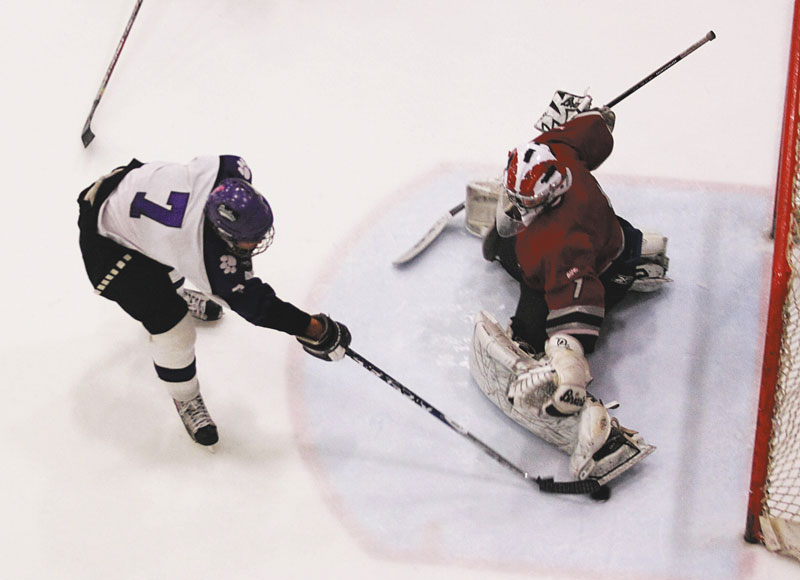 Photo by Jeff Pouland SEEING THE GOAL: Josh Gaudette scores one of Waterville’s five third-period goals during against Bangor during a 7-2 victory in an Eastern Maine Class A seminfinal Saturday in Lewiston.