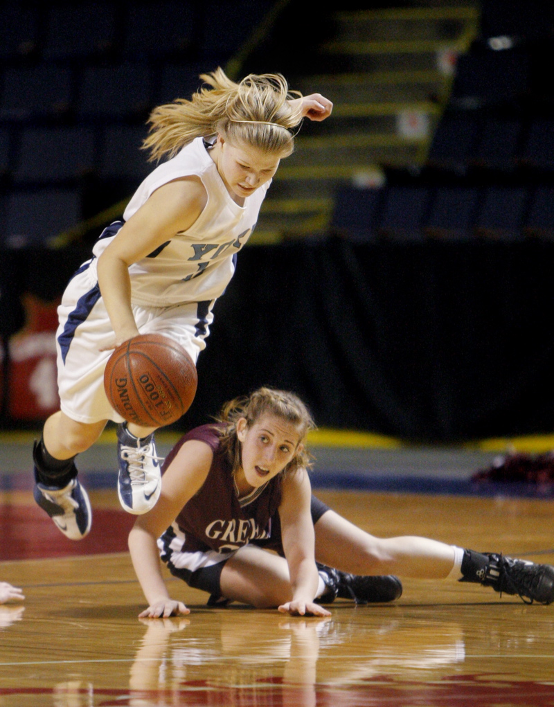 Amdrea Mountford of York trips over Nicole Faietta while chasing a loose ball.