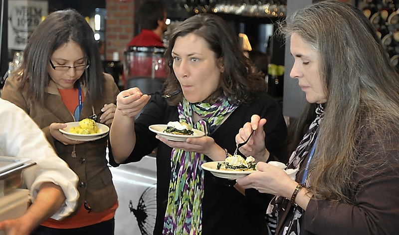 Frances Mercado, left, Kristin Rieff and Elena Schmidt, all staff members at Preble Street social service agency, enjoy entries by the Port Hole and Sea Glass restaurants on Friday at the Incredible Breakfast Cook-Off at the Sea Dog Brewing Co.