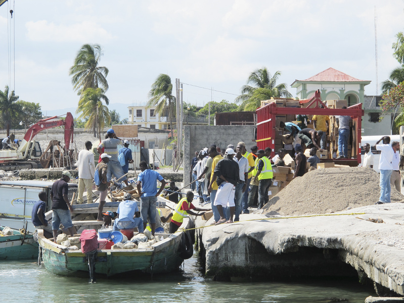 Haitian workers at the dock in Les Cayes transfer relief supplies Friday from Sea Hunter onto a truck for transport to Hope Village, an orphanage and community assistance program operated by the Rev. Marc Boisvert, a native of Lewiston.