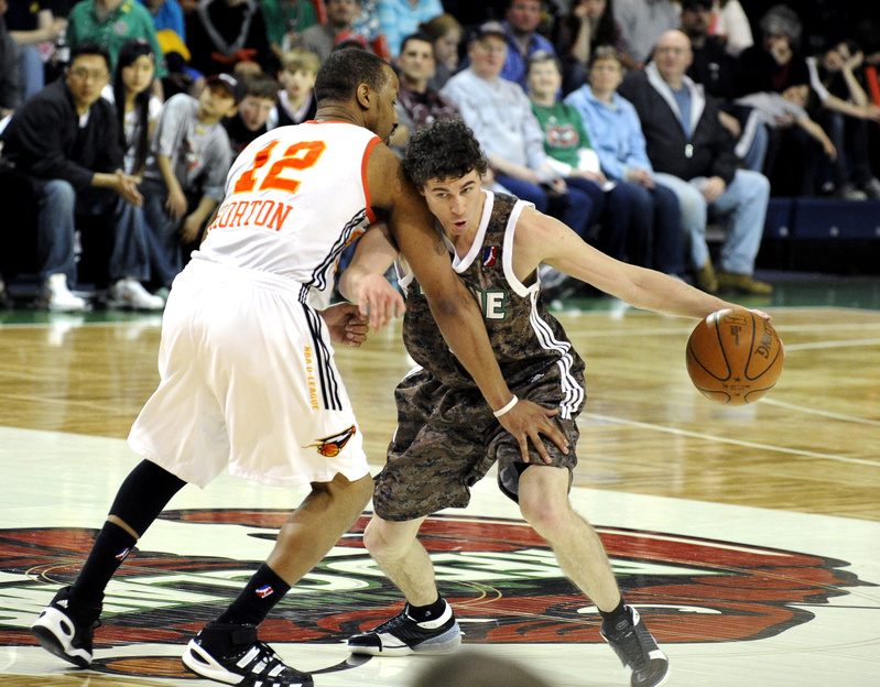 Brock Gillespie, who joined the Red Claws on Friday after spending most of the season in Finland, then Lebanon, drives on Jason Horton of the Albuquerque Thunderbirds.