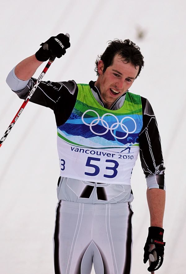 Ben Koons, a Messalonskee High graduate representing his native New Zealand, makes it to the finish line in the men’s 50-kilometer mass start cross country ski race.