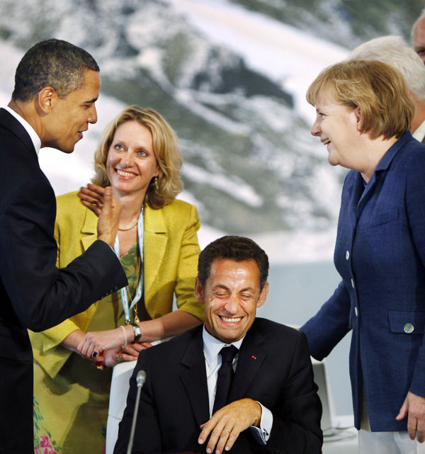 Obama jokes with French President Nicolas Sarkozy, seated, and German Chancellor Angela Merkel, right, before the start of G8 meetings in L'Aquila, Italy. How does Obama rate on the scale of modern presidential humor? Pretty high, it turns out. "I think he does have a good sense of humor," says Meena Bose, a presidential historian at Hofstra University. "He has a cerebral one, though. It's this dry irony. You have to pay pretty close attention to get some of what he's saying."