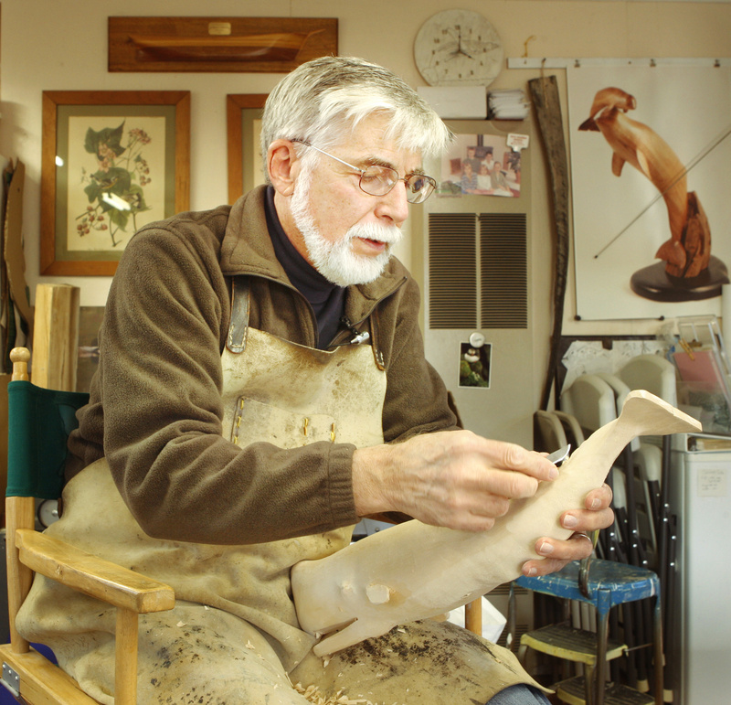 Robbins works on a sperm whale in the shop at his Bath home. He concentrates on whales but has also carved other sea creatures, such as dolphins.