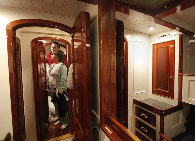 Brian and Liz LaPoint of Rochester, N.H., stroll through the living quarters of the Alden Schooner Lion’s Whelp, designed and built by Phineas Sprague.