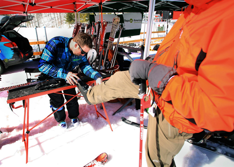 Greg Sutcliffe of Nordica checks the length of Scott Rudel’s boot as he sets the binding pressure on skis for Rudel to take for a test run down the slopes.