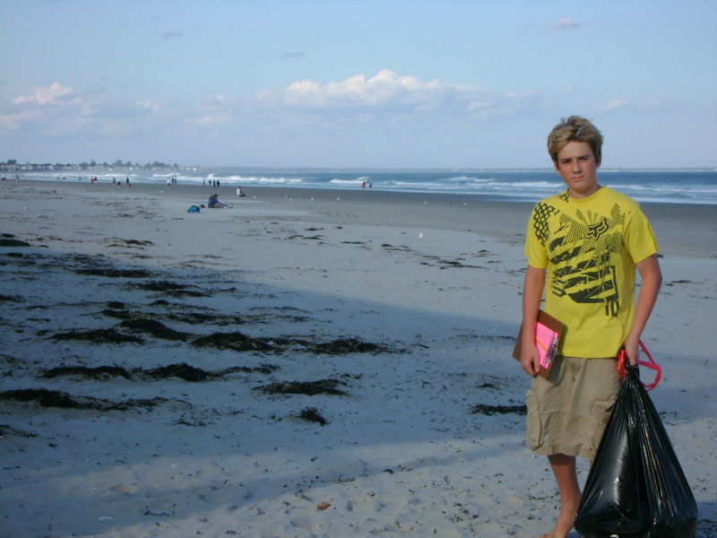 Andrew Hayford, 16, of Cape Neddick collects trash and records his findings during the 2009 International Coastal Cleanup in Ogunquit. Hayford has received a grant to fund an anti-litter campaign for southern Maine beaches.