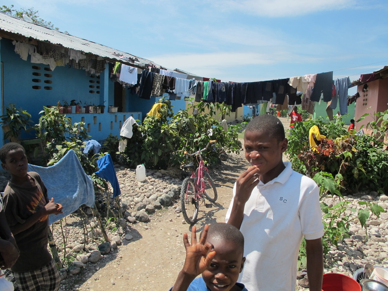 Orphan boys greet visitors to their housing units at Hope Village in Les Cayes, where they maintain small gardens at the entrance to each dormitory. The village has recently added about 200 children, fleeing the aftermath of the Jan. 12 quake.