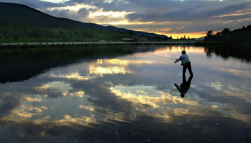 A fly fisherman tries his luck at Saco Lake, the headwaters of the Saco River. Gregory Rec Saco river Source to sea