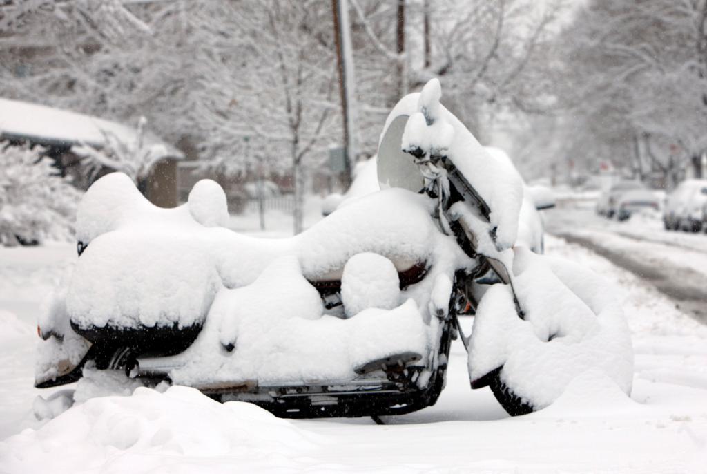 A motorcycle is muffled by snow in this file photo. Many Mainers would prefer to keep them quieter even when they are moving, say a number of readers.