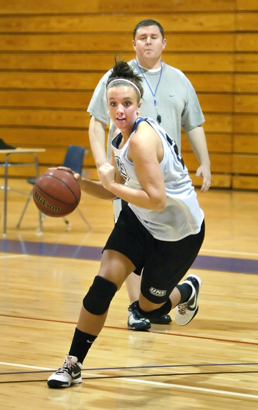 Margo Russell drives to the basket in Monday’s workout. “We set a goal and we worked hard,” said Russell, a UNE sophomore from Madison.
