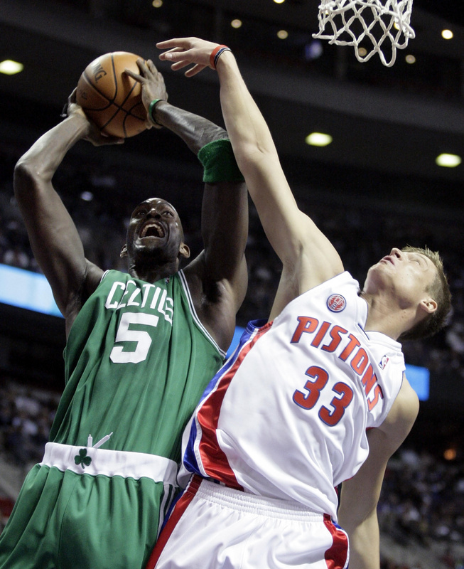 Kevin Garnett of the Boston Celtics takes the ball to the basket Tuesday night against Jonas Jerebko of the Detroit Pistons during the Celtics’ 105-100 victory.