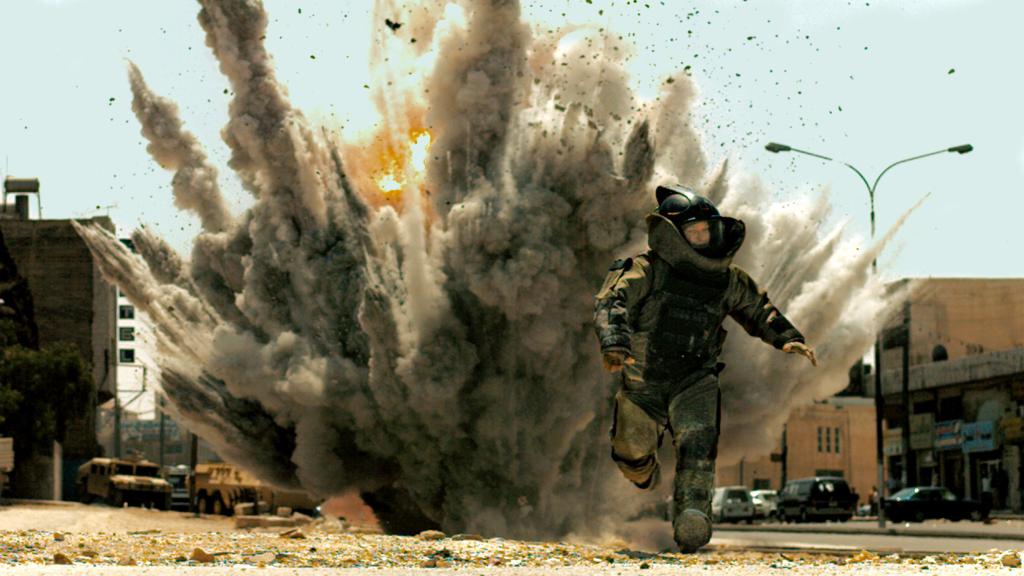 FICTION: In a scene from “The Hurt Locker” Jeremy Renner, playing a swaggering bomb technician, narrowly escapes an explosion. Explosives experts say a team leader’s first priority “is getting his team home in one piece.”