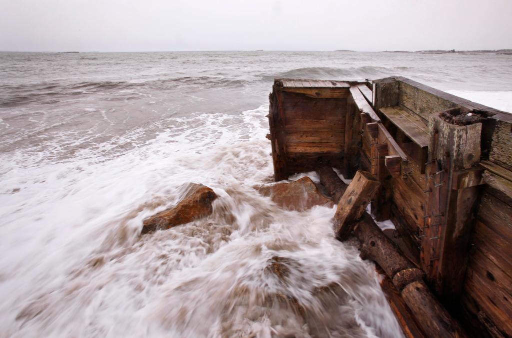 Waves pound the seawall at Camp Ellis in Saco Thursday. The front section was taken out during the Patriots Day storm.
