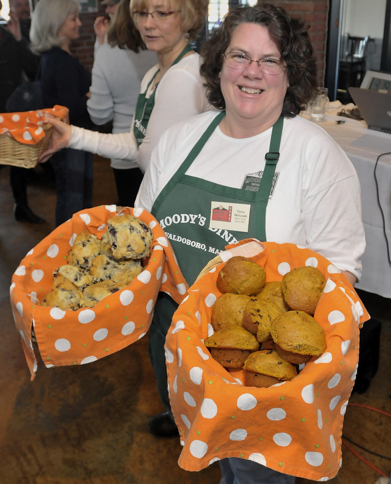Terry McGrath of Moody’s Diner in Waldoboro shares blueberry and pumpkin nut muffins at the Maine Restaurant Week event.