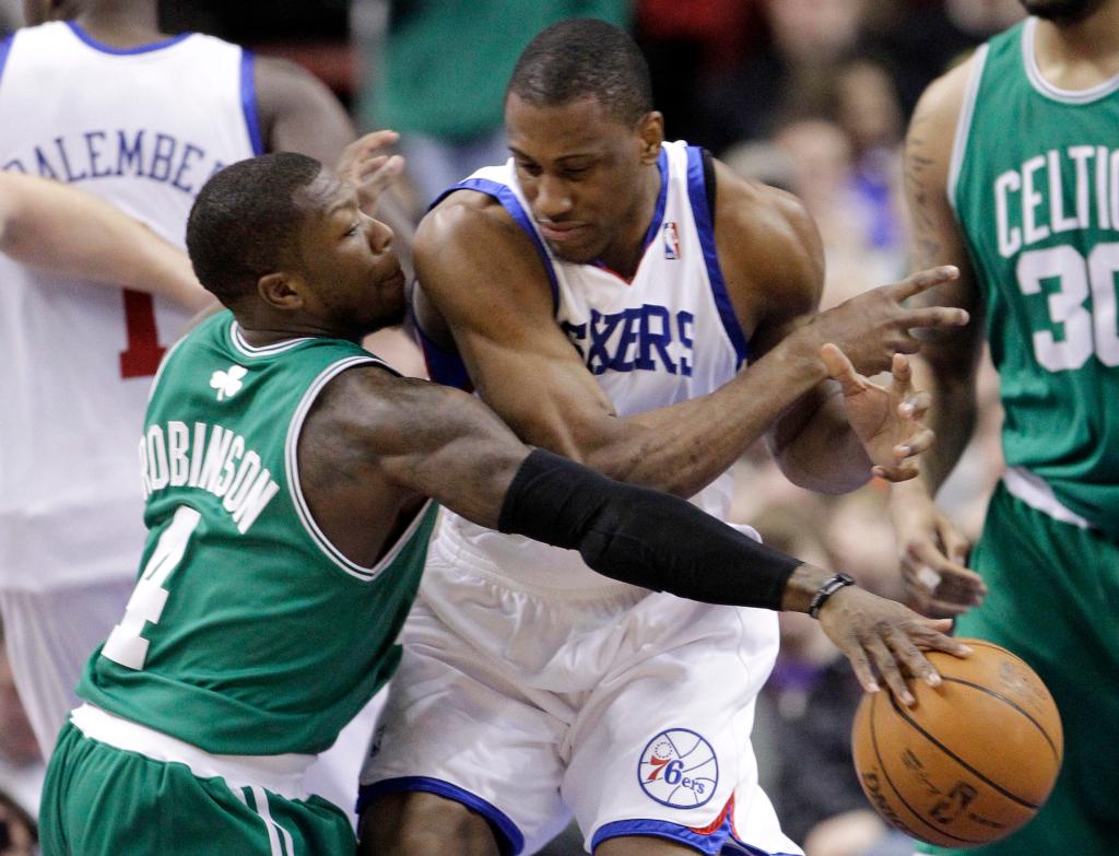 Nate Robinson of the Boston Celtics, left, steals the ball from Thaddeus Young of the Philadelphia 76ers during the first half of the Celtics’ 96-86 victory Friday night.