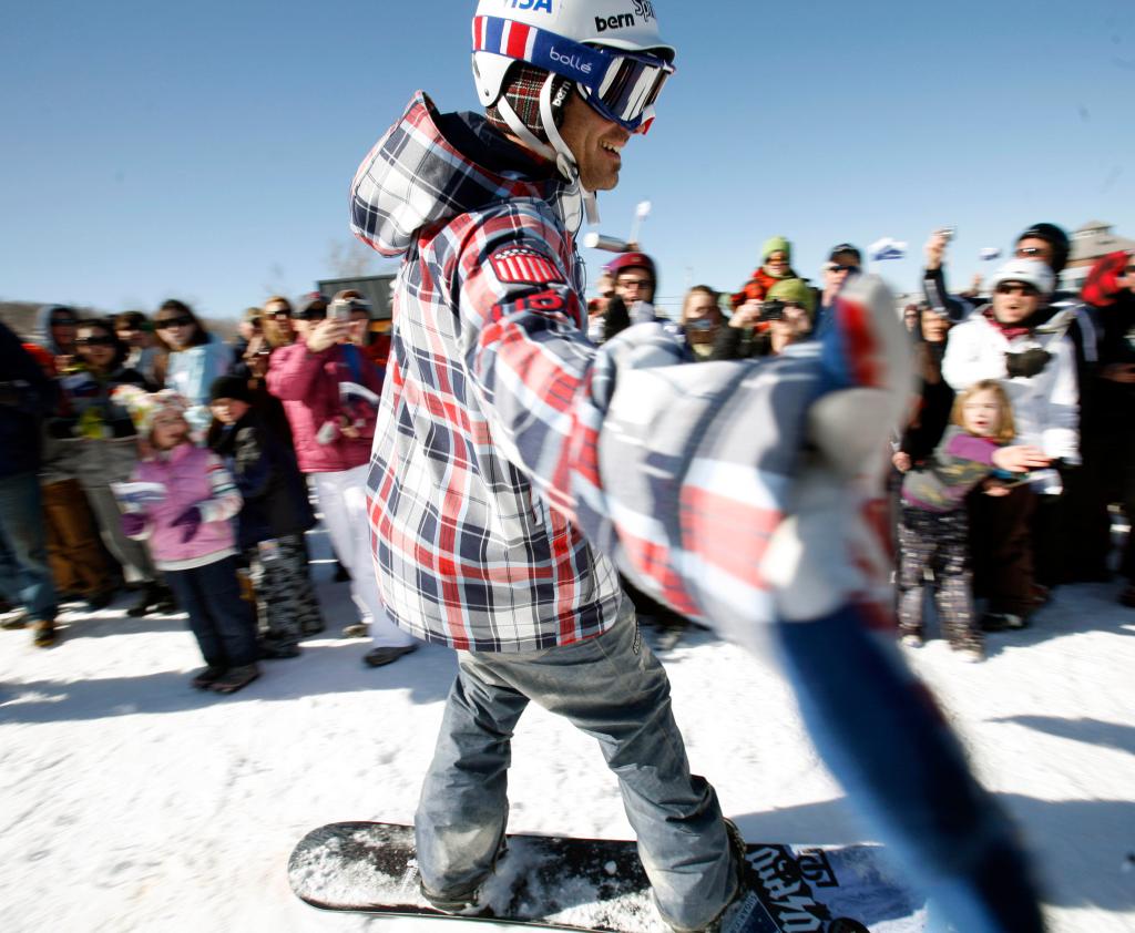 Seth Wescott reaches out to shake hands as he is welcomed by fans at a celebration for him at Sugarloaf Mountain in Carrabassett Valley on Saturday. Last month, Wescott won the snowboardcross gold medal at the Winter Olympics in Vancouver, British Columbia.