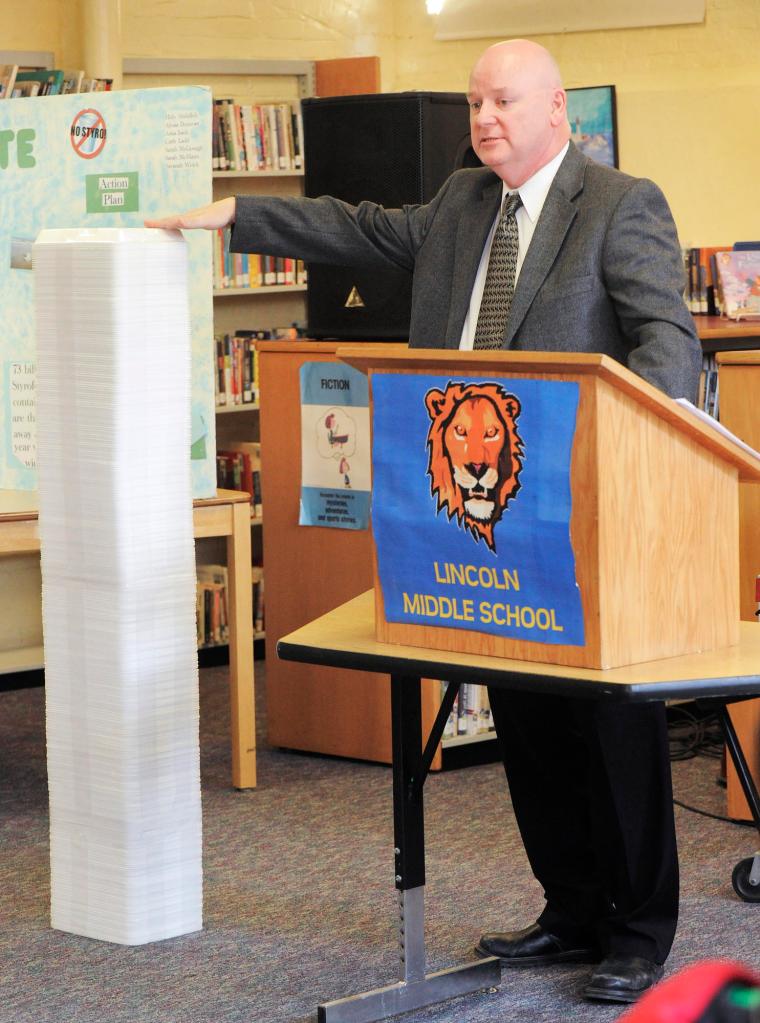 Portland Superintendent of Schools Jim Morse shows the amount of Styrofoam waste generated each day at Lincoln Middle School as part of the recycling program introduction.