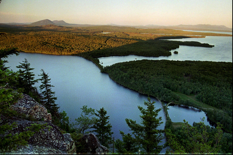 Undeveloped forestland extends from the eastern shore of Moosehead Lake north of Greenville in this summertime photo.