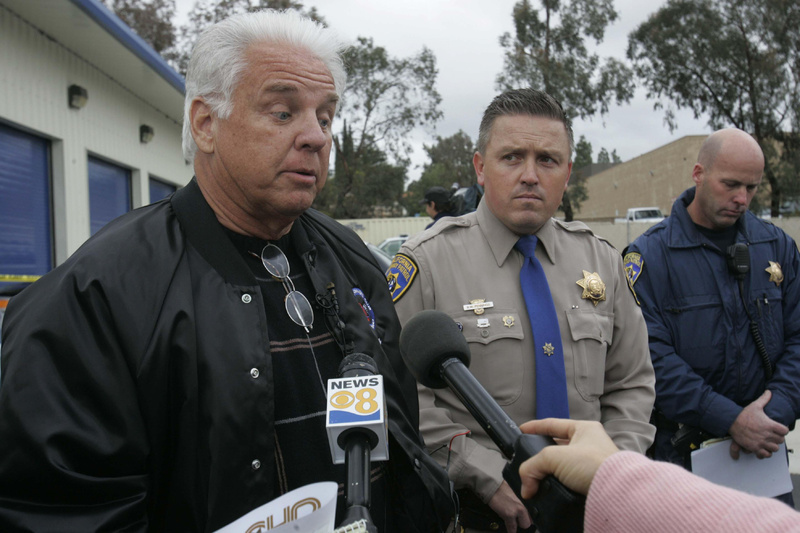 James Sikes, left, of Jacumba, Calif., describes to the media how he was able to bring his runaway Prius to a stop on the highway Monday, with the help of Officer Todd Niebert, right, of the California Highway Patrol. At center is Officer Brian Pennin, a CHP spokesman.
