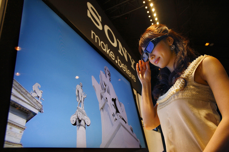 The Associated Press A model wearing 3-D glasses watches Sony’s 3-D television during its introduction Tuesday in Tokyo. Sony will start selling the televisions in June, joining an industry push to convince consumers to embrace the technology.