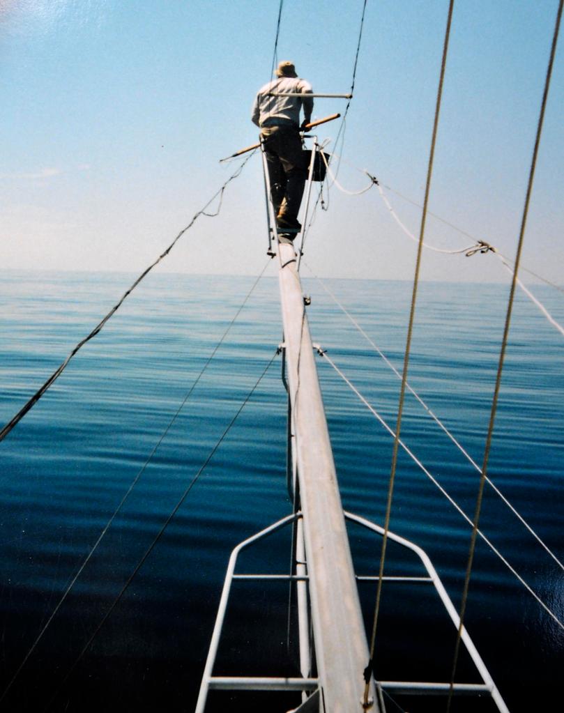 David Linney hunts a school of tuna from the “tuna pulpit” on a boat in July 2004.