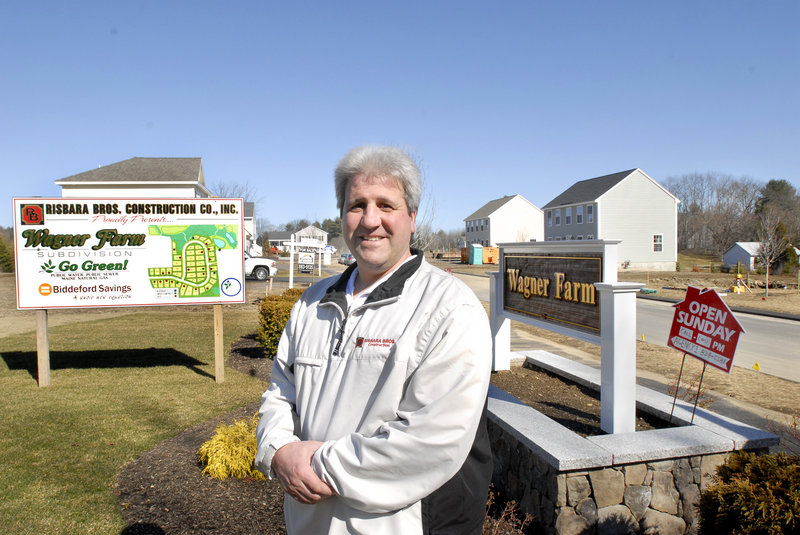 Bill Risbara stands in front of a Risbara Bros. construction site in Gorham where he is developing a 42-lot subdivision. Risbara said he's down to 16 lots at Wagner Farm and is preparing to buy more land. "We're in an acquisition mode," he said.